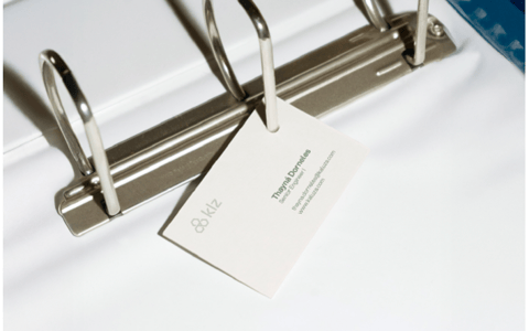 Kaluza business card in a ring binder