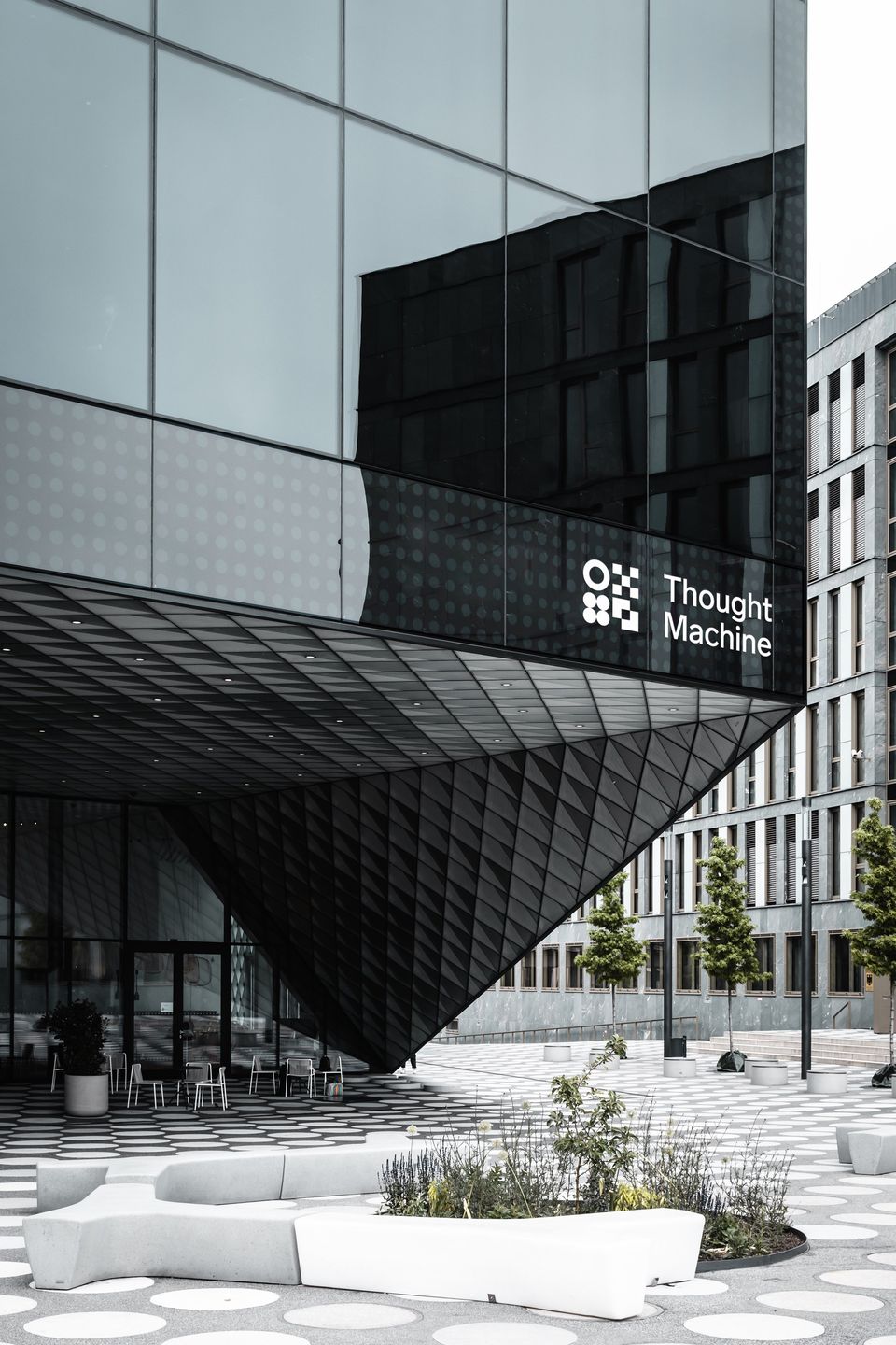 Thought Machine logo on a glass office building