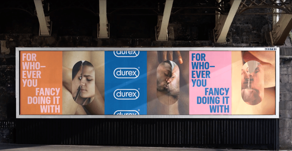 Durex billboard with couples and colourful campaign panels